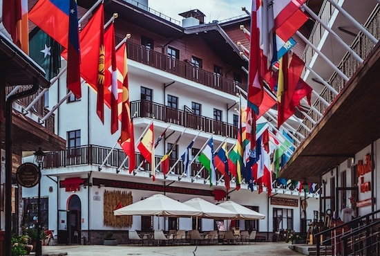 Buildings flying flags from various countries