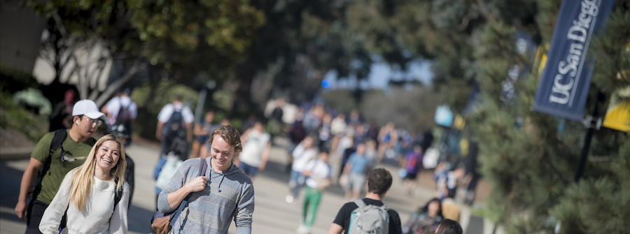 students walking on a UC San Diego sidewalk
